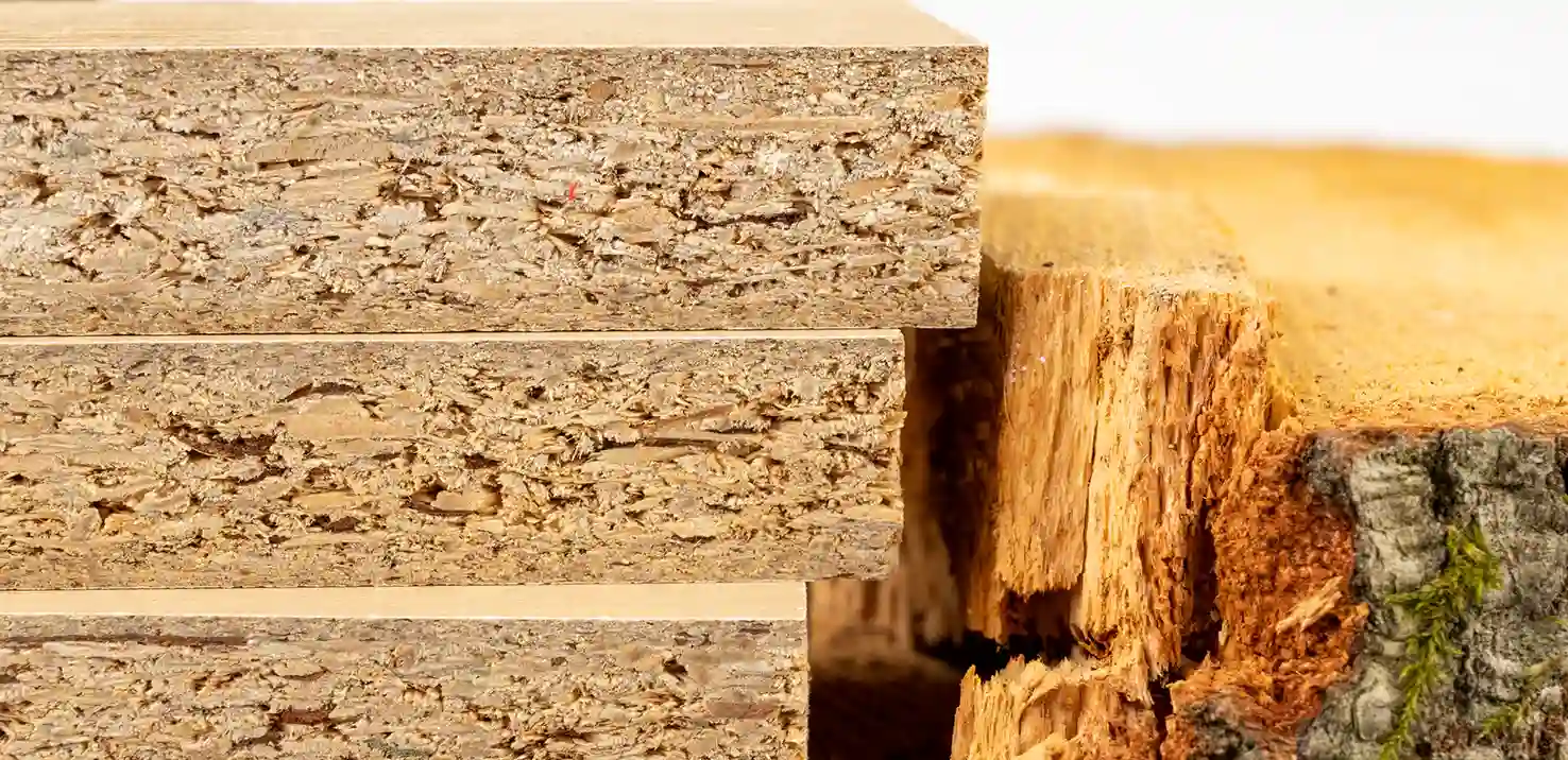 Wood chips bonded with synthetic resin adhesives under high heat and pressure Chipboard Particleboard