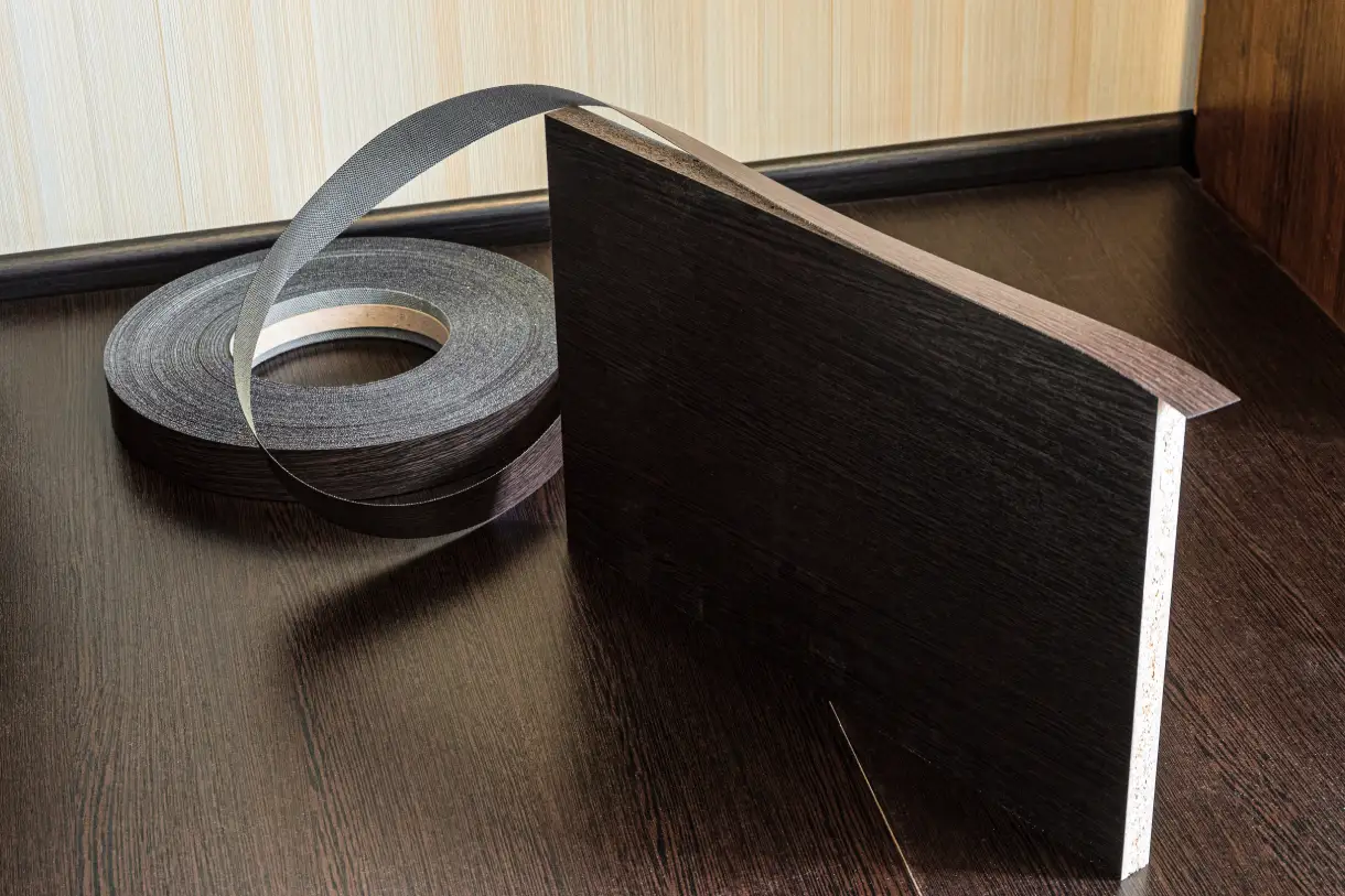 Thin pliable band strips covering exposed panel edges with matching colors & textures Edge Banding